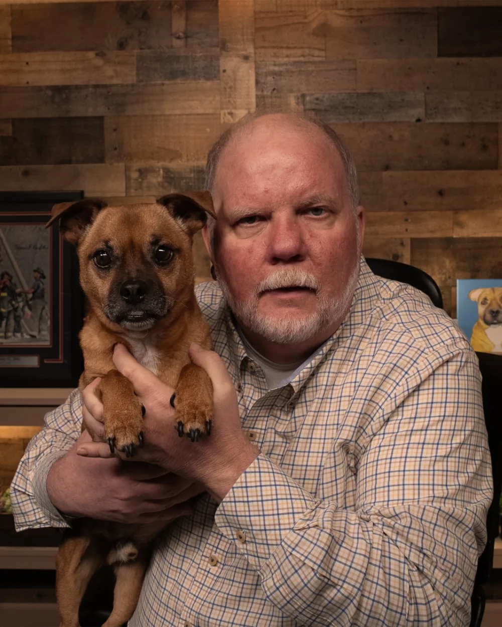 Jeff Kahler, author of Gutter to Go-Getter, holding his dog Pork Chop